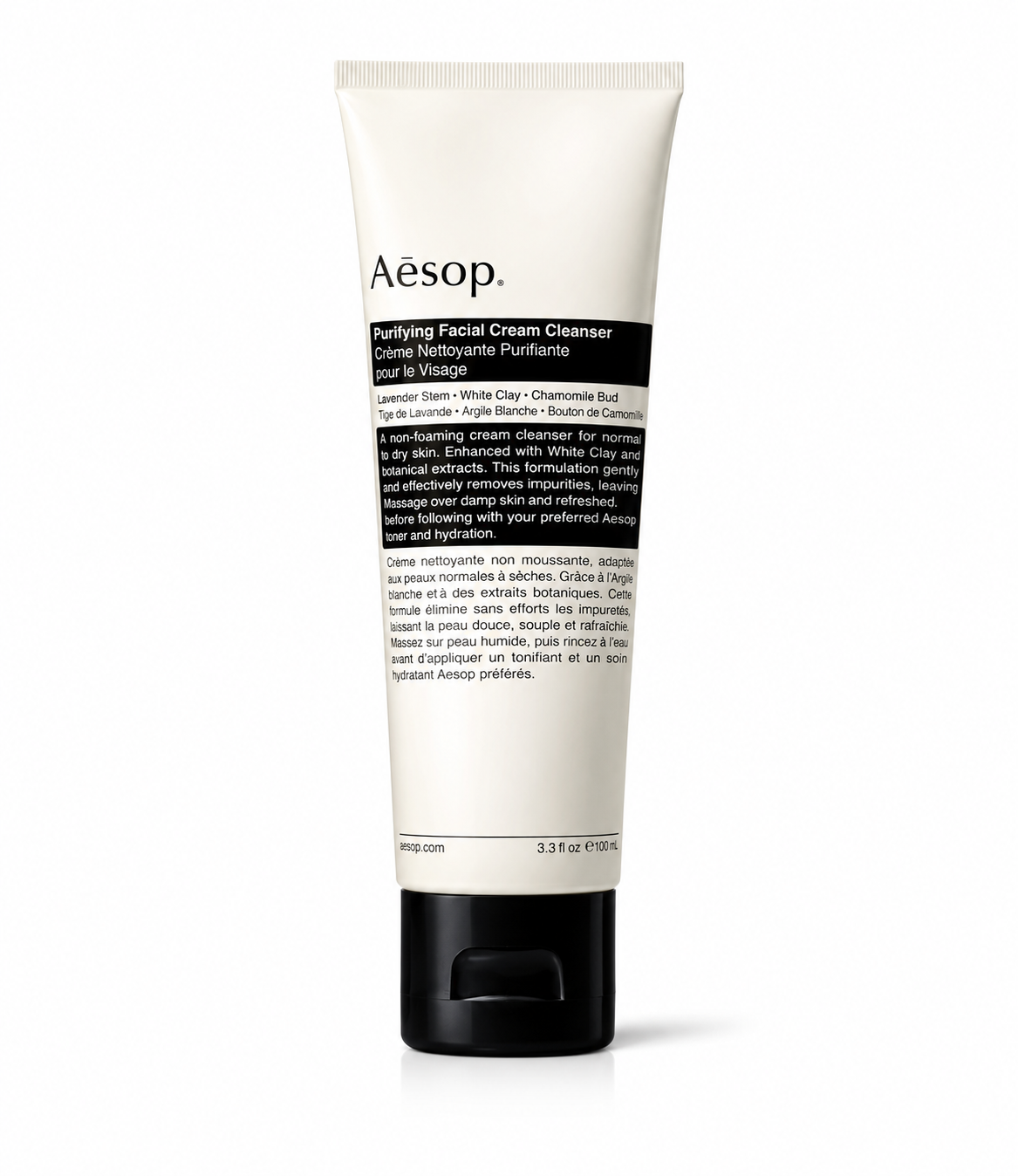 Aesop Purifying Facial Cream Cleanser in a white tube with a black flip-top cap and Aesop's signature minimalist label, isolated on a white background. This non-foaming facial cream cleanser is formulated with lavender stem, white clay, and chamomile bud to gently remove impurities, cleanse without stripping moisture, soothe the skin, and leave normal to dry skin feeling soft, balanced, and refreshed.