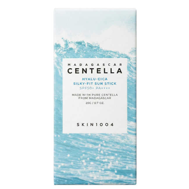 Blue and white packaging for SKIN1004 Madagascar Centella Hyalu-Cica Silky-Fit Sun Stick featuring a vibrant ocean wave graphic and SPF 50+ PA++++ labeling.