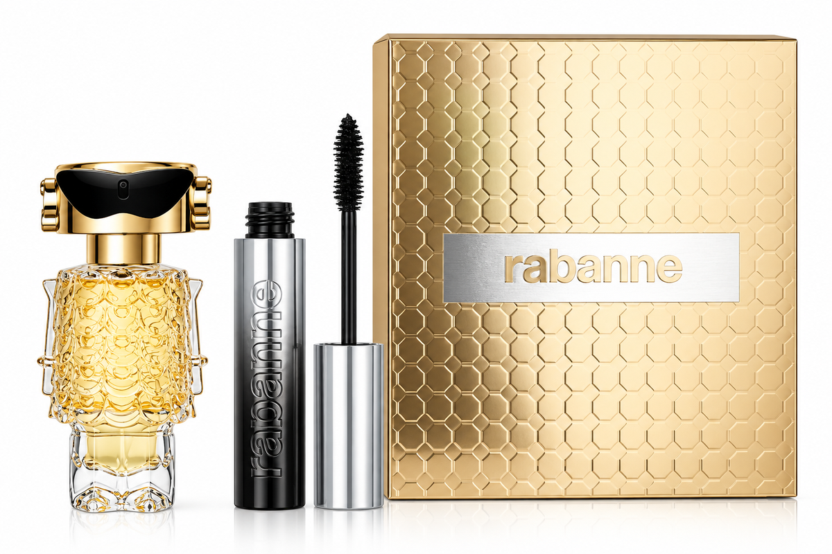 Rabanne Fame gift set featuring the distinctive gold robot-inspired Fame perfume bottle and matching Rabanne mascara with applicator, presented beside an elegant textured gold gift box with metallic Rabanne branding on a clean white background.
