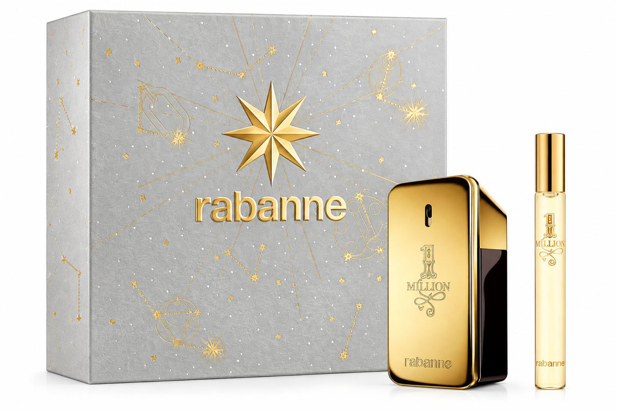 Rabanne 1 Million gift set presented in an elegant silver and gold celestial-themed presentation box, featuring the iconic gold bar-shaped 1 Million Eau de Toilette bottle alongside a matching travel spray. The luxurious metallic packaging, embossed Rabanne branding and decorative star details create a premium gift-ready presentation, photographed against a clean pure white background.