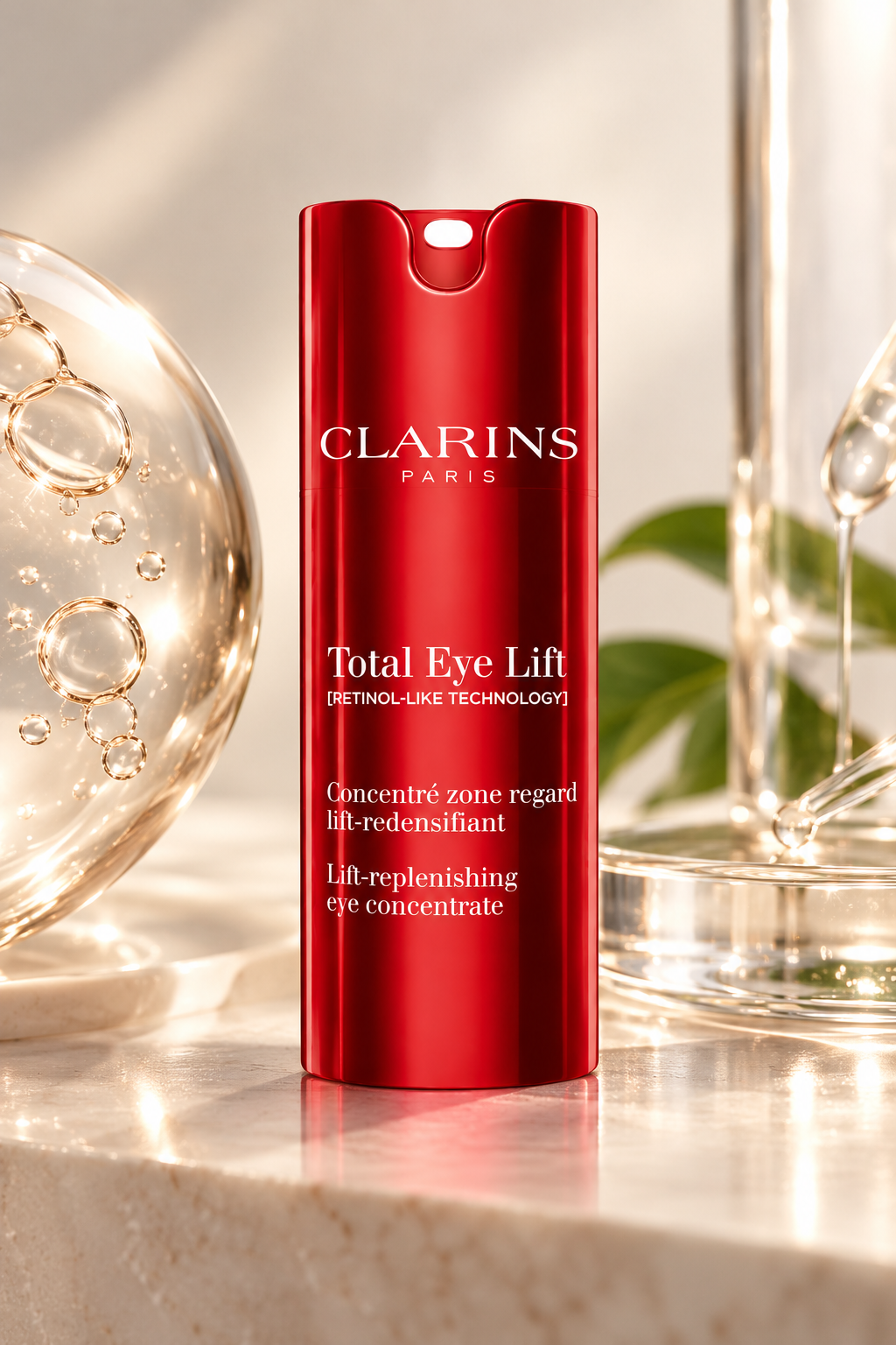 Clarins Total Eye Lift anti-aging eye concentrate in its signature glossy red bottle, elegantly displayed on a beige marble surface with warm lighting, transparent glass details and soft greenery. Luxury eye treatment designed to target wrinkles, puffiness and loss of firmness.